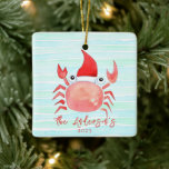 Waterverf Rode krab Santa Hat Beach Kerstmis Keramisch Ornament<br><div class="desc">Verbeter uw kustkerstdecor met ons charmante Beach Christmas Ornament. Dit unieke ornament is voorzien van een heerlijke Waterverf rode krab op een Santa Hat, geplaatst tegen een serene achtergrond van waterverf abstracte oceaangolven in licht aqua blauw en mint groen. Maak dit ornament echt uw eigen door het te personaliseren met...</div>