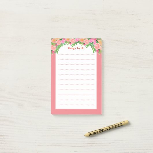 Waterverf roze bloemen hebben dingen te doen post-it® notes (Op bureau)