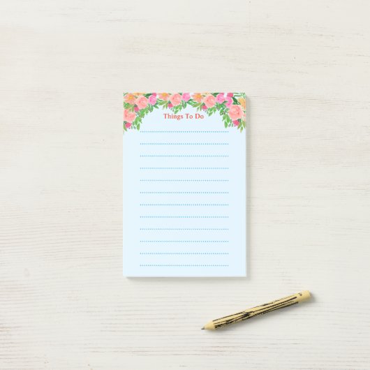 Waterverf roze bloemen hebben dingen te doen post-it® notes (Op bureau)
