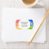 Waterverf van regenboog omringt moderne kleurrijke etiket (Insitu)