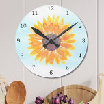 Waterverf Zonnebloem Ronde Klok<br><div class="desc">Deze bloemenklok is versierd met een waterverf gele zonnebloem en blauwe hemelachtergrond. Maakt een perfect huis verwarmend cadeau. Originele Waterverf © Michele Davies.</div>
