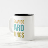 We kunnen hard dingen doen tweekleurige koffiemok (Voorkant links)