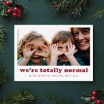 We zijn heel normaal grappig familie foto kerst feestdagenkaart<br><div class="desc">Leg de humor en blijdschap van het seizoen vast met deze speelse kerstkaart "We're Totally Normal". Met een openhartige familiefoto omarmt dit ontwerp de grappige, gekke momenten die uw gezin uniek maken. De moderne rode tekst en de eenvoudige lay-out bieden een charmante maar humoristische touch, waardoor deze kaart perfect is...</div>