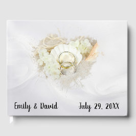 Wedding Rings in Seashell On White Satin Gastenboek