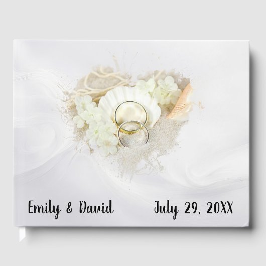 Wedding Rings in Seashell On White Satin Gastenboek (Voorkant)