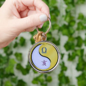 Weegschaal en metalen beer sleutelhanger (Hand)