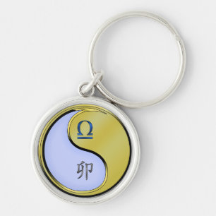 Weegschaal en metalen konijn sleutelhanger