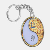 Weegschaal en vuurkonijn sleutelhanger (Voorkant Links)