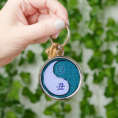 Weegschaal en wateros sleutelhanger (Hand)