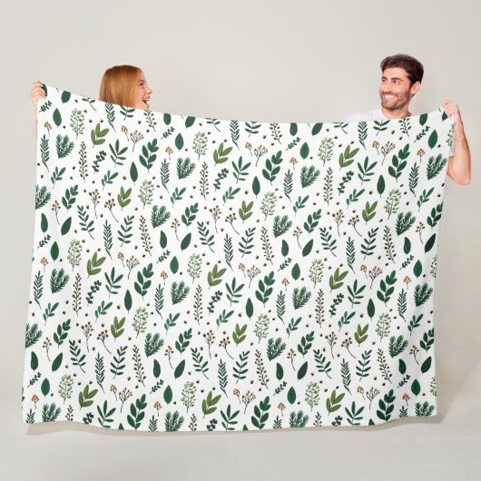 Weelderige groene bladeren en bloemen op wit fleece deken (In situ)