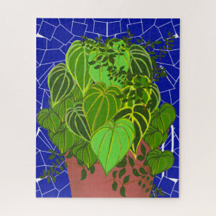 Weelderige groene bladeren in terracotta op blauwe legpuzzel