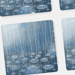 Weer een regendag onderzetter set<br><div class="desc">Het schilderen van regen en pudzels die op een blauwe achtergrond rondzweven. Een typische Engelse zomerdag.</div>