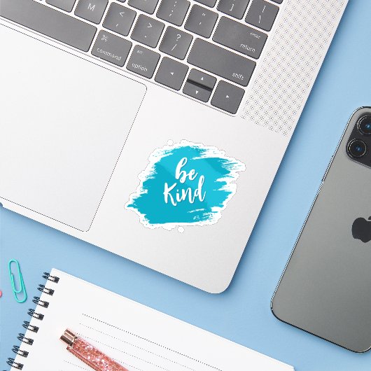 wees aardig sticker (Laptop met iPhone)