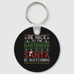 Wees aardig tegen de barman die kerstman kijkt naa sleutelhanger