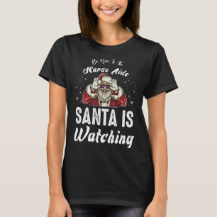 Wees aardig tegen de verpleegkundige Aide Santa ki T-shirt