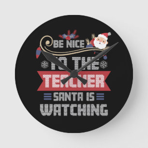 Wees aardig voor de juf Kerstman kijkt toe Leraar Ronde Klok