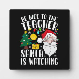 Wees aardig voor de leraar Kerstman kijkt toe Lera Fotoplaat
