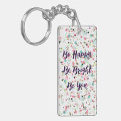 "Wees blij. Wees helder. Ben jij." Ik citeer  stip Sleutelhanger (Voorkant Links)