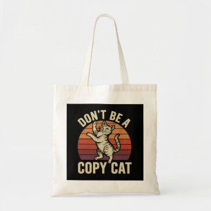 Wees geen kopieerkat tote bag