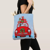 Weimaraner hond in auto met kerstman tote bag (Dichtbij)