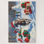 Weimaraner loopt in de sneeuw met kerstmuts legpuzzel (Verticaal)