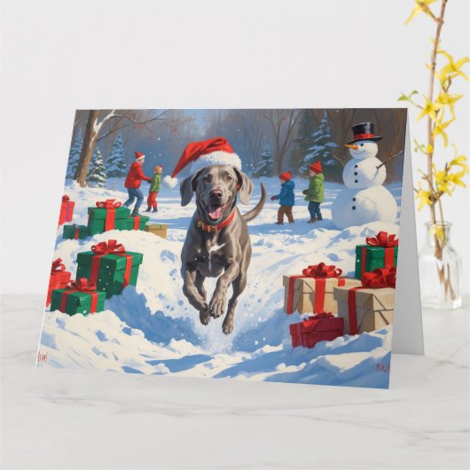 Weimaraner Rent in de Sneeuw met Kerstmuts Kaart (Gele Bloem)
