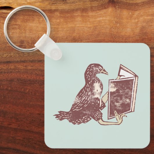 Weka Bird leest een boek Sleutelhanger (Voorkant)