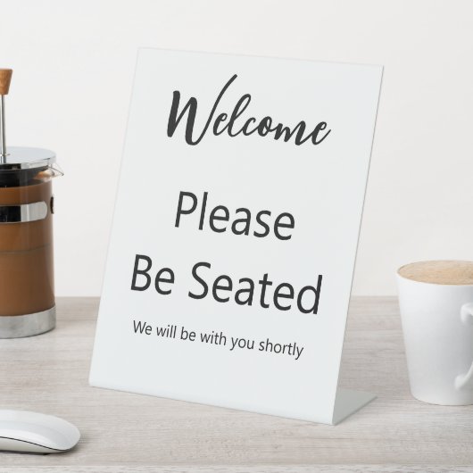 Welcome Please Be Seated White and Black Script Reclamebord Met Voetstuk (Insitu)