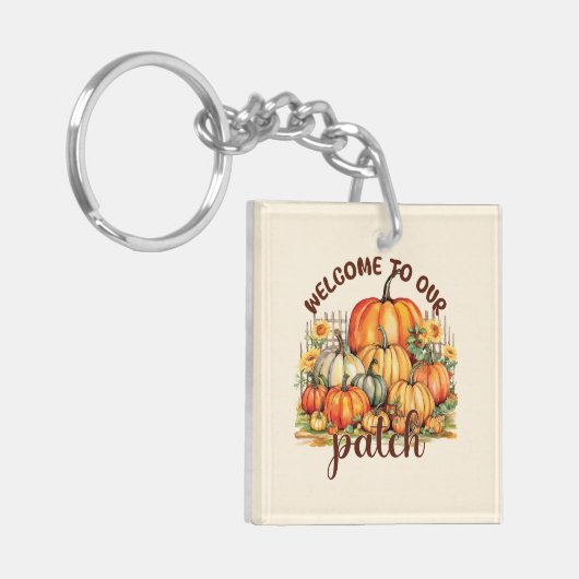 Welkom bij Onze Patch – Cosy Pumpkin Patch Sleutelhanger (Voorkant Links)