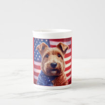 Welsh Terrier met Amerikaanse vlag en bandana