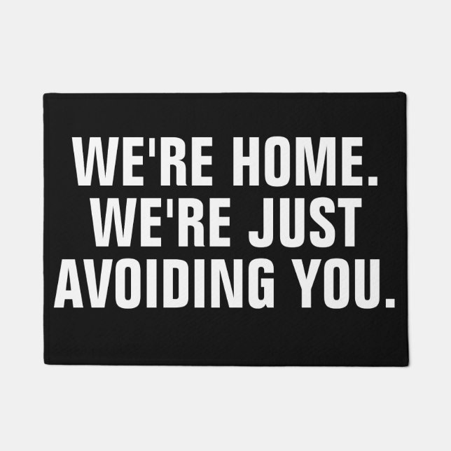 WE'RE HOME. WE'RE JUST AVOIDING YOU. DEURMAT (Voorkant)