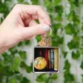 Wereldbol en boeken Sleutelhanger (Hand)