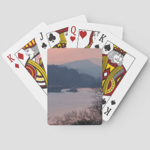 Werken aan de rivier bij zonsondergang pokerkaarten