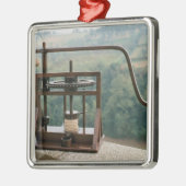 Werkmodel van de olijvenpers metalen ornament (Links)