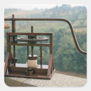 Werkmodel van de olijvenpers vierkante sticker