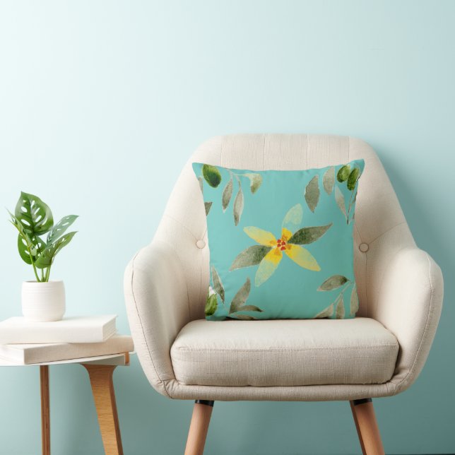 Werpkussen met olijfdesign op licht teal kussen (Stoel)