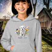 West Highland Terriër en wilde bloemen