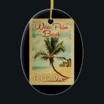 West Palm Beach Palm Tree Vintage Travel Keramisch Ornament<br><div class="desc">Een unieke retro mid-eeuwse moderne West Palm Beach Florida-kunst van het oude poster. Het bevat een gebogen palmboom op zandige stranden met oceaan onder een blauwe troebele hemel.</div>