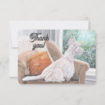 Westie kijkt uit een raam