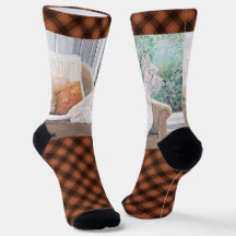 Westie kijkt uit een raam