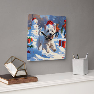Westie rent in de sneeuw met kerstmuts vierkante klok