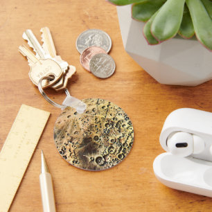 wetenschapscultuur, raketschild over de maan sleutelhanger