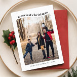 Whimsical Zwart & Wit Familie Foto Kerstmis Feestdagenkaart<br><div class="desc">Leg de vreugde van het vakantieseizoen vast met deze grillige zwart-witte familiefoto-kerstkaart. Met een speelse gebogen "vrolijkste kerst" typografie aan de bovenkant en een minimalistische lay-out, benadrukt deze kaart uw familiefoto op een leuke, moderne manier. Perfect voor het delen van uw vakantie juichen, deze dubbelzijdige kaart bevat een persoonlijke begroeting...</div>