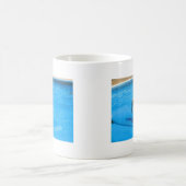 White Cockapoo Dog Swimming on a Raft Koffiemok (Center)