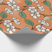 White Floral Design on Oranje Cadeaupapier (Hoek)