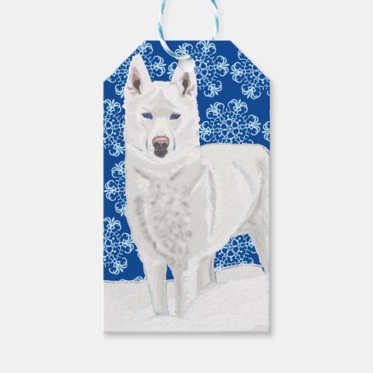 White Husky tegen sneeuwvlokken en donkerblauwe he Cadeaulabel (Voorkant)
