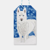 White Husky tegen sneeuwvlokken en donkerblauwe he Cadeaulabel (Achterkant)