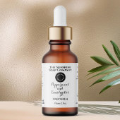 White w curly text and logo dropper bottle label