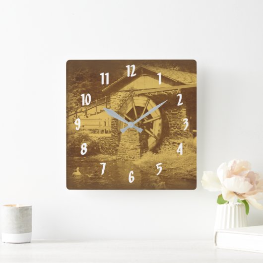 Wiel en eend van hout in sepia vierkante klok (Huis)