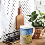 Wielveld met Krogen van Van Gogh Porselein Kop<br><div class="desc">Een mooie Mok van Bone China met het schilderij 'Wheatfield with Crows' (1890) van Vincent van Gogh (1853-1890). Hij beschouwde zijn laatste schilderij,  maar de kunsthistorici verschillen hierover. Een zandweg door de velden met een blauwe hemel en een kudde kraaien.</div>